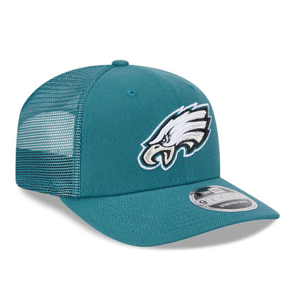 Philadelphia Eagles NFL Evergreen Dark Green New Era 9SEVENTY Stretch Snap Cap, three-quarter view with a raised embroidered Eagles logo on the front panel, mesh side panels, and a 9SEVENTY size sticker on the visor.
