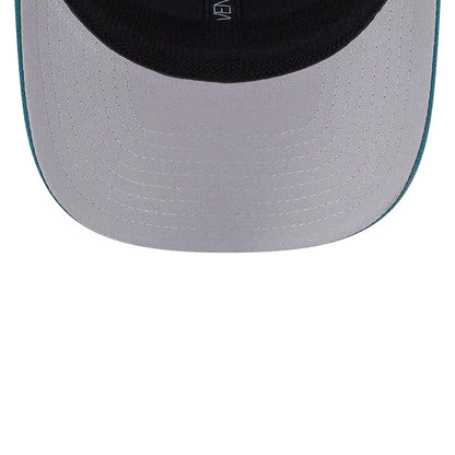 Philadelphia Eagles NFL Evergreen Dark Green New Era 9SEVENTY Stretch Snap Cap, inside view showing the black sweatband and grey undervisor with a New Era branded taping detail along the inner seams.