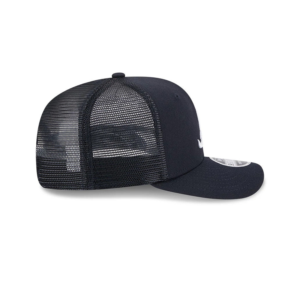 Atlanta Braves MLB Evergreen Navy New Era 9SEVENTY Stretch Snap Adjustable Cap, side view showing the mesh back panels, curved visor with a 9SEVENTY size sticker, and structured front crown with the embroidered logo.