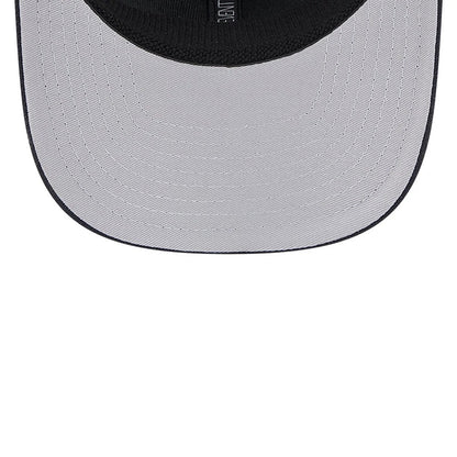 Atlanta Braves MLB Evergreen Navy New Era 9SEVENTY Stretch Snap Adjustable Cap, inside view with a grey undervisor and black sweatband, showing neat stitching and a central woven label.
