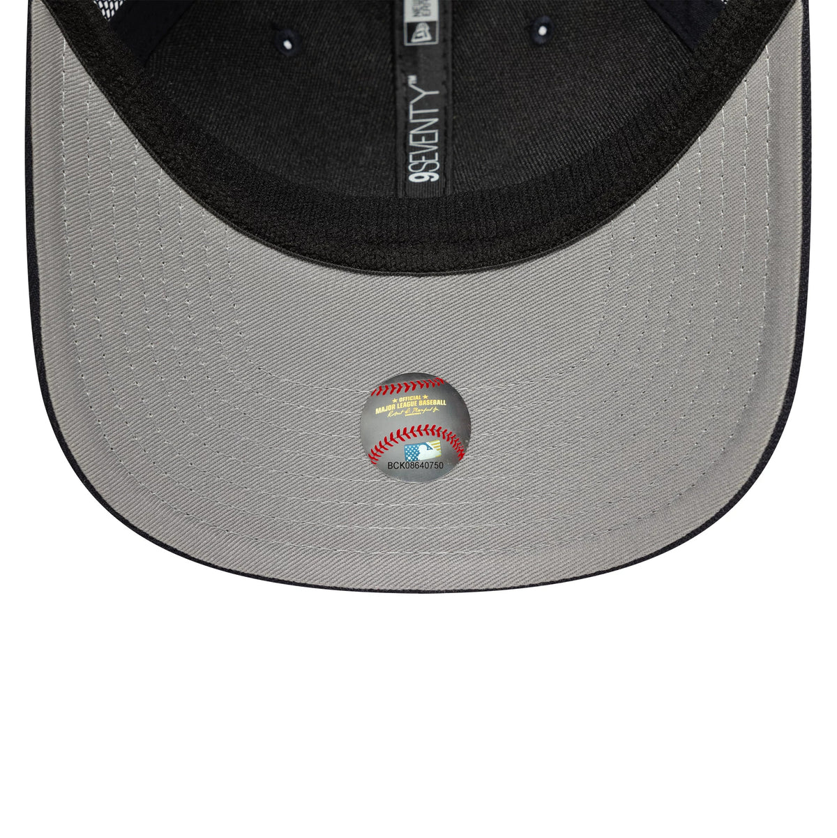 New York Yankees MLB Official Team Colour Navy New Era 9SEVENTY Stretch Snap Adjustable Cap, inside view showing the grey undervisor with a baseball-themed holographic sticker and the black sweatband featuring 9SEVENTY taping.