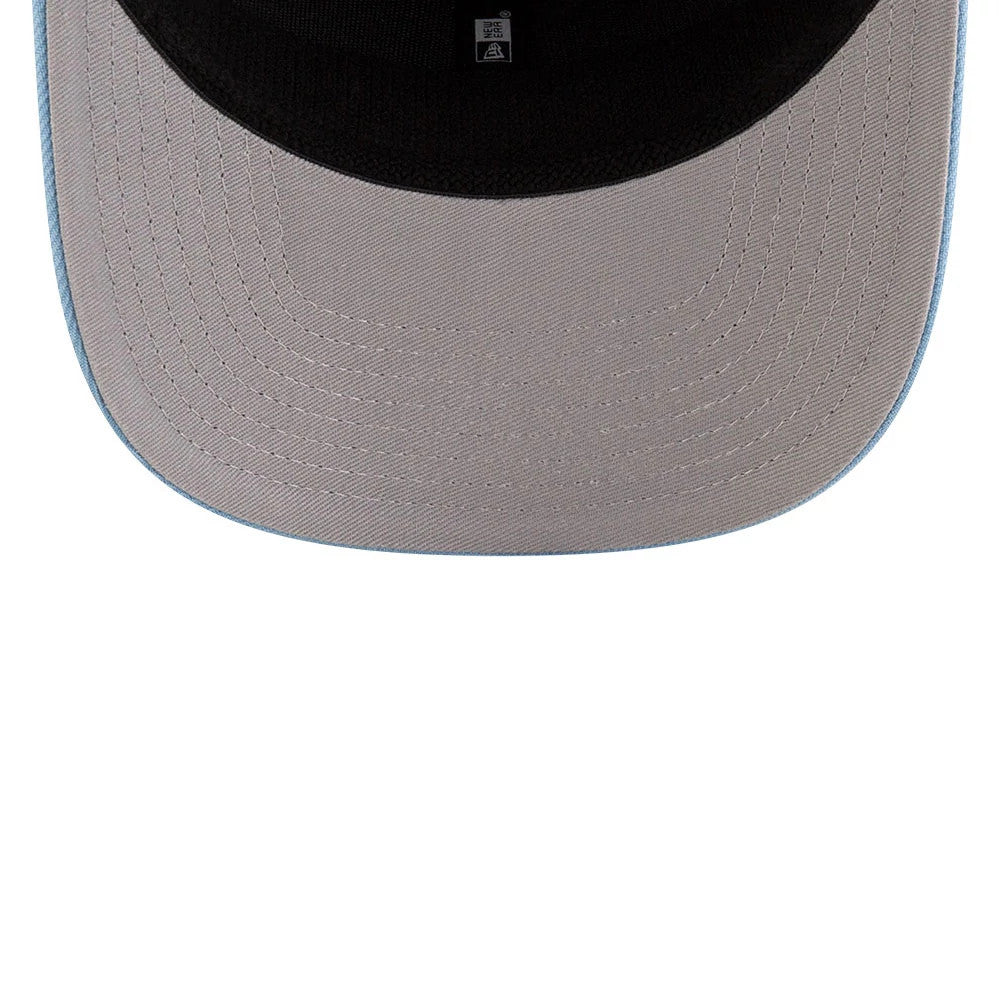Memphis Grizzlies NBA Statement Pastel Blue New Era 9SEVENTY Stretch Snap Adjustable Cap, inside view showing the black sweatband and grey undervisor with a small New Era tag on the taping.