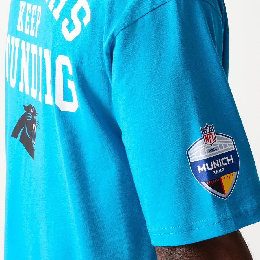 The Male model is wearing Carolina Panthers NFL Games Square Arch Bright Blue Oversized T-Shirt 3