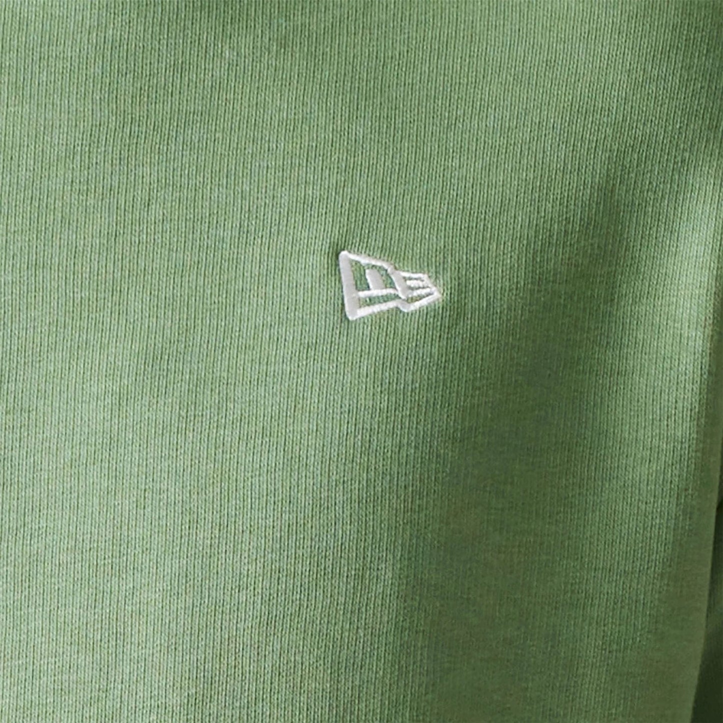 The Male model is wearing New Era Essential Pastel Green Oversized Crewneck Sweater 4