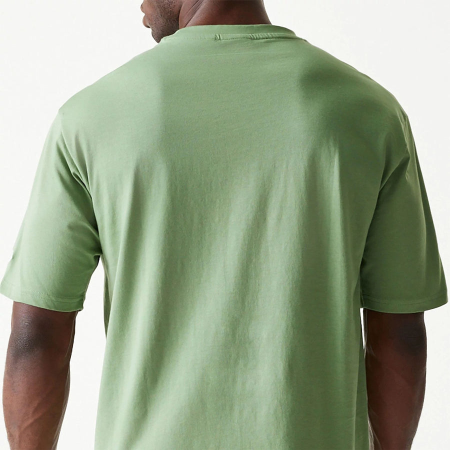 The Male model is wearing New Era Essential Green Oversized T-Shirt 7