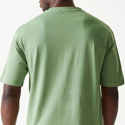 The Male model is wearing New Era Essential Green Oversized T-Shirt 7
