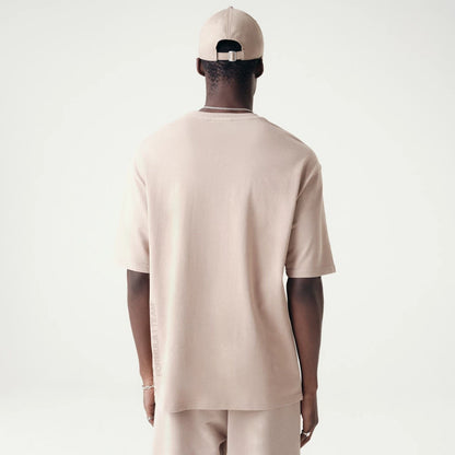 The Male model is wearing McLaren Racing Washed Pack Beige Oversized T-Shirt 2