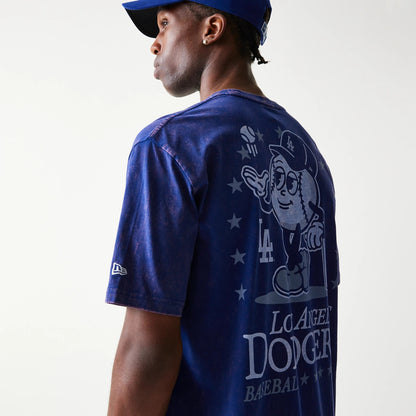 New Era LA Dodgers MLB Character Dark Blue T-Shirt, three-quarter view showing a large white graphic of a cartoon character on the back with LA Dodgers text below, and a small embroidered New Era logo on the sleeve.