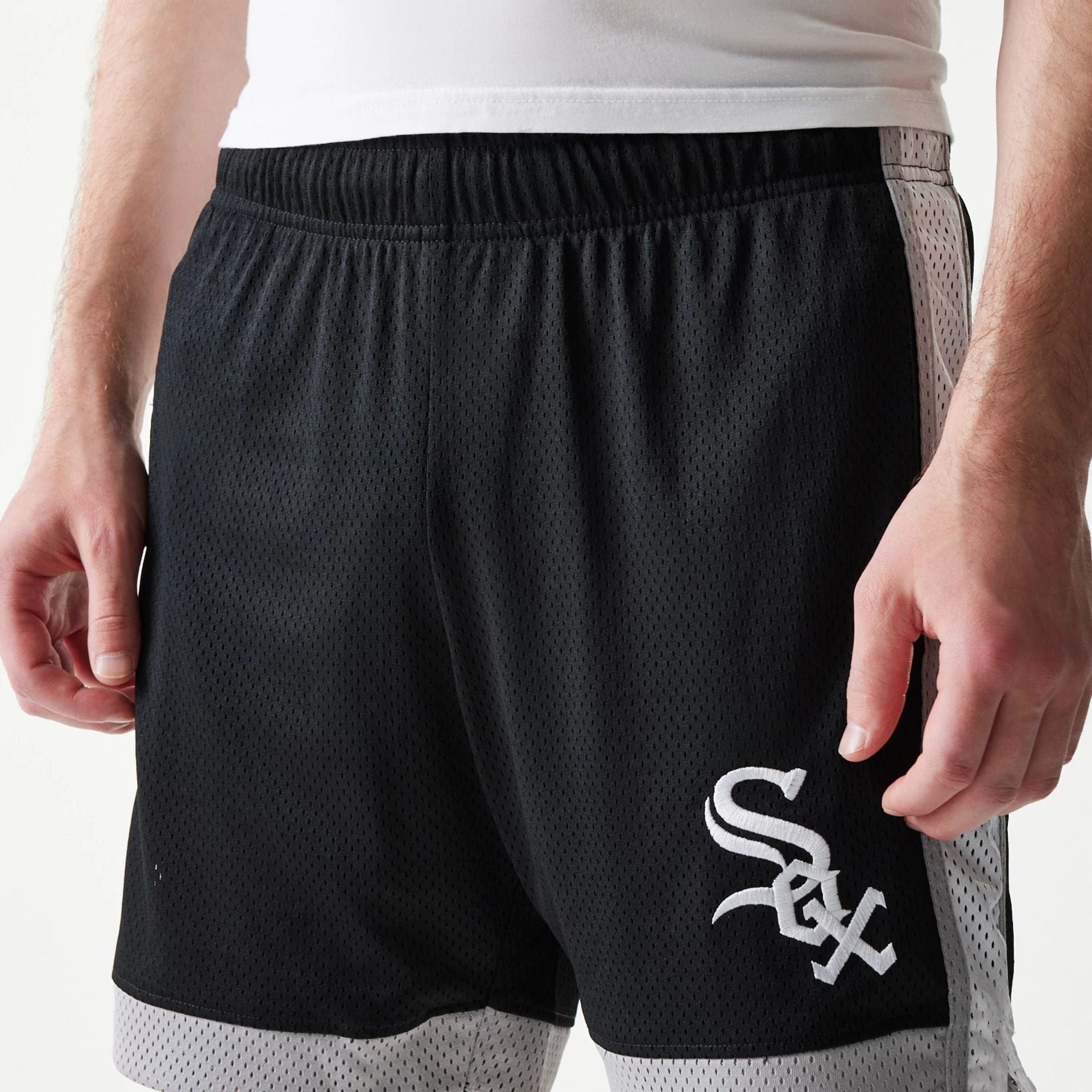 The Male model is wearing Chicago White Sox Sport Classic Black Shorts 5