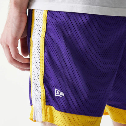 The Male model is wearing LA Lakers Sport Classic Purple Shorts 4