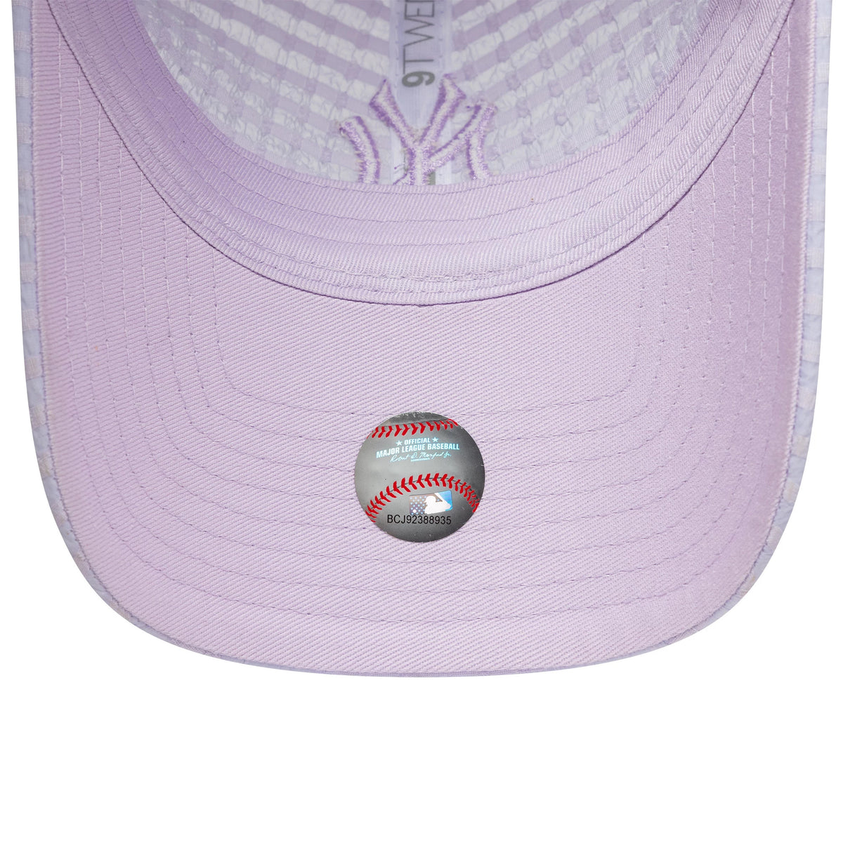 New York Yankees Womens MLB Seersucker Pastel Purple New Era 9TWENTY Adjustable Cap, inside view showing the pastel purple undervisor, embroidered NY logo on the taping, and official MLB holographic sticker on the underside of the visor.
