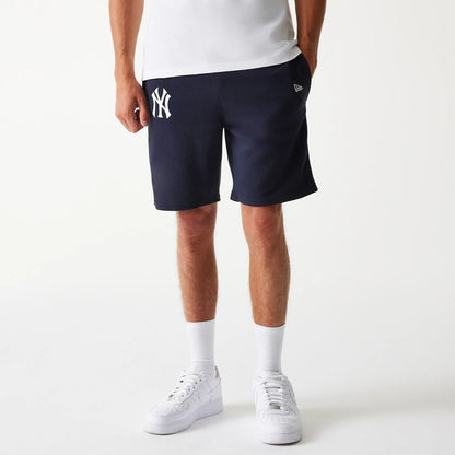 The Male model is wearing New York Yankees MLB League Essential Navy Shorts 1
