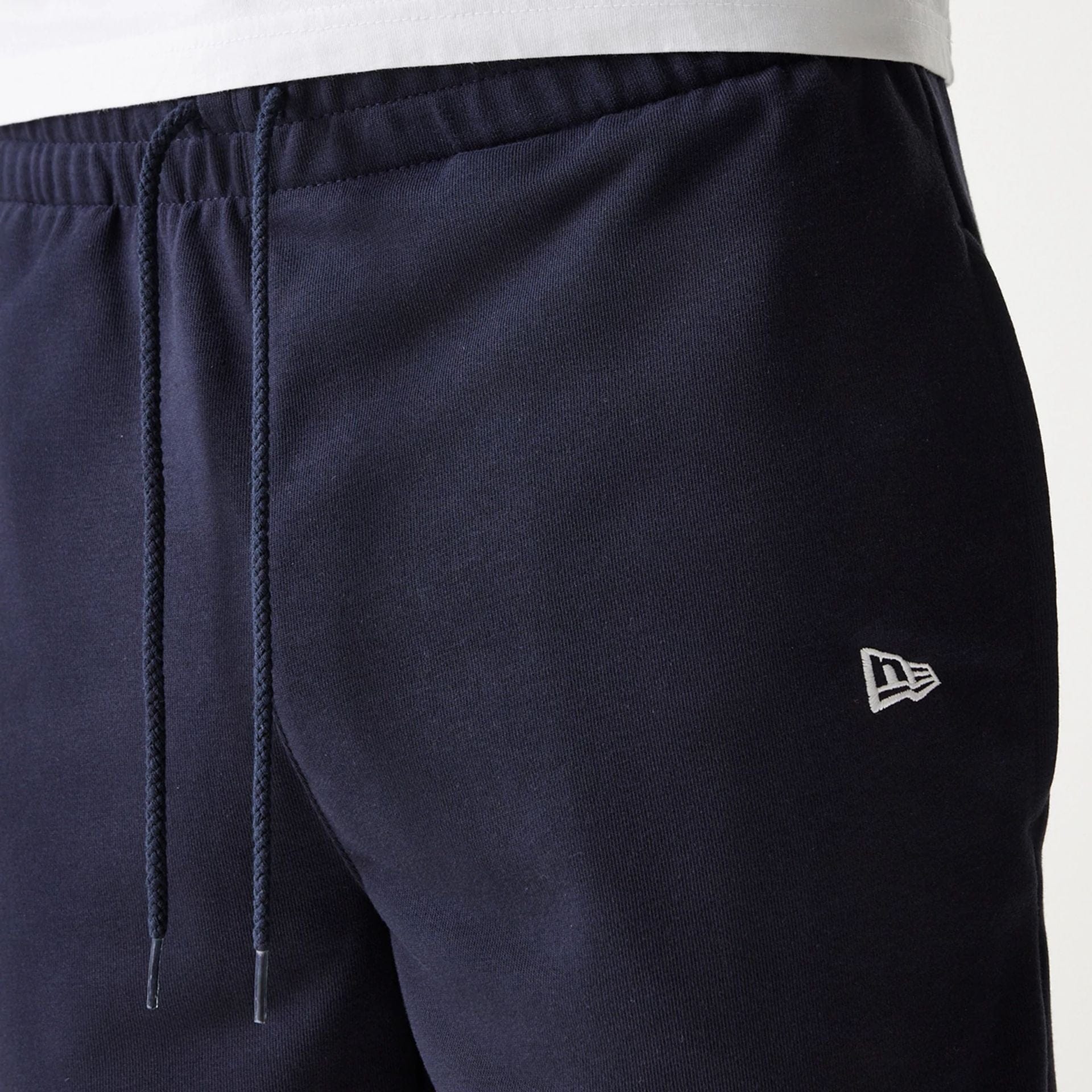 The Male model is wearing New York Yankees MLB League Essential Navy Shorts 6