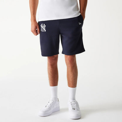 The Male model is wearing New York Yankees MLB League Essential Navy Shorts 1