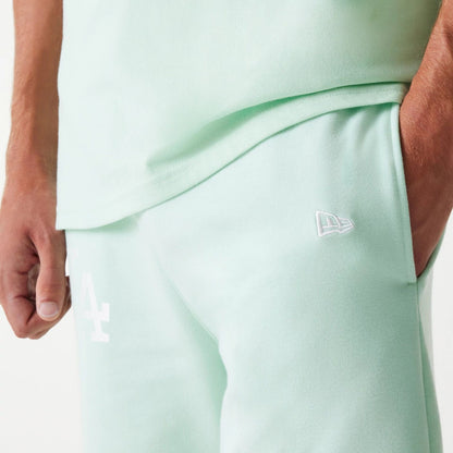 The Male model is wearing LA Dodgers MLB League Essential Pastel Green Shorts 5