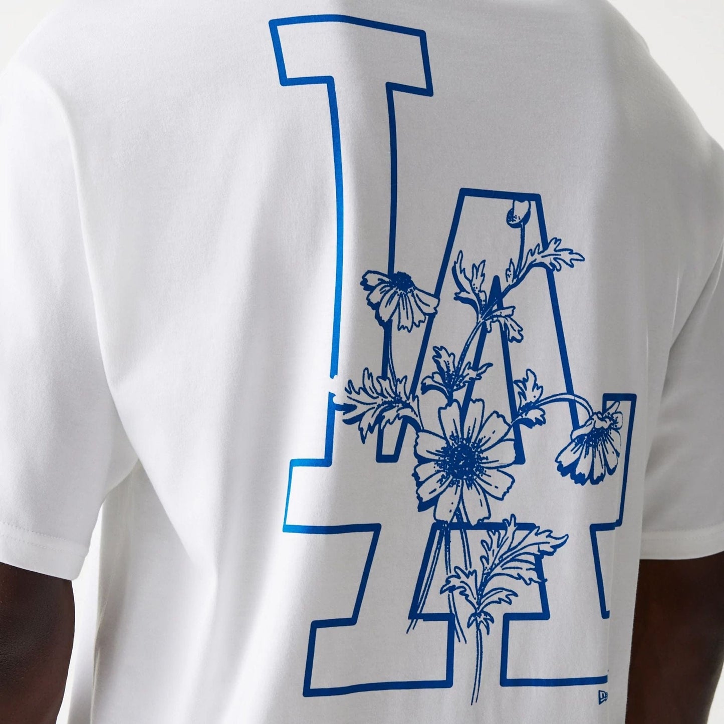 The Male model is wearing LA Dodgers MLB Floral Graphic White Oversized T-Shirt 4
