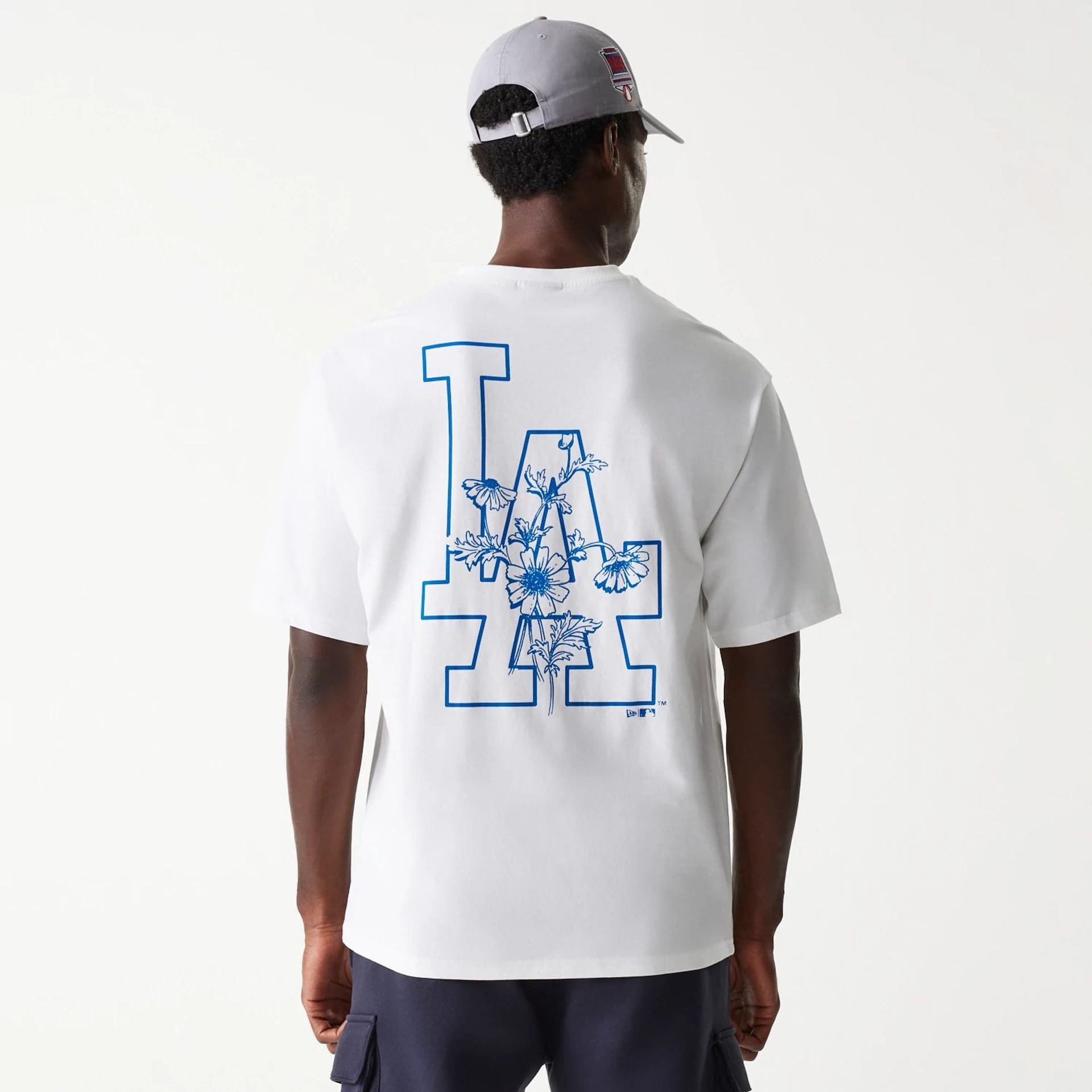 The Male model is wearing LA Dodgers MLB Floral Graphic White Oversized T-Shirt 2