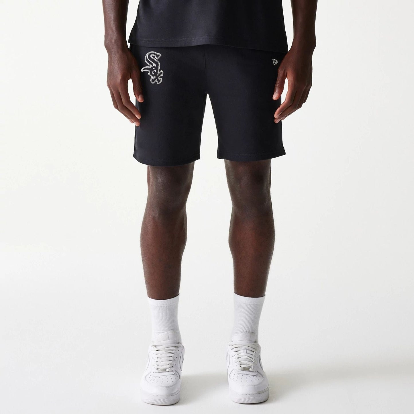 The Male model is wearing Chicago White Sox MLB League Essential Black Shorts 1