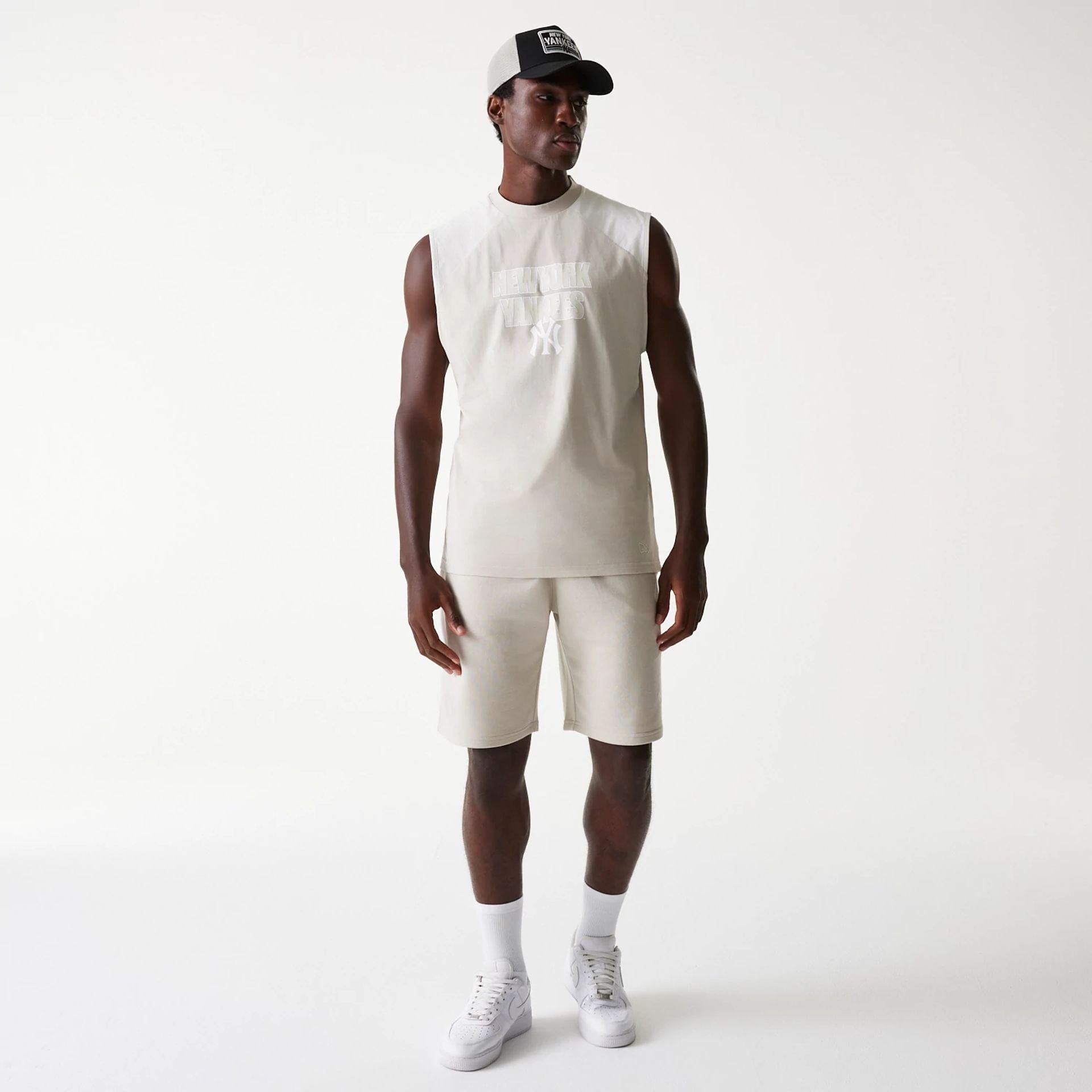 The Male model is wearing New York Yankees MLB Raglan Cream Shorts 8