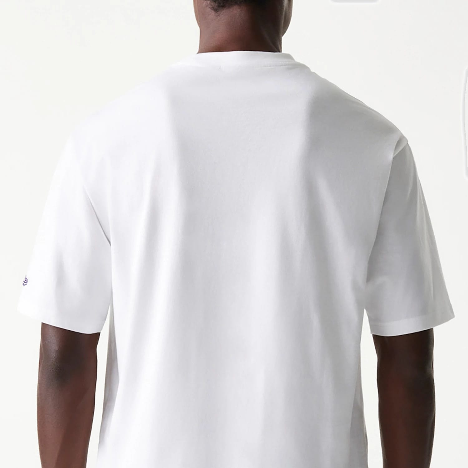 The Male model is wearing LA Lakers NBA Team Graphic White Oversized T-Shirt 7