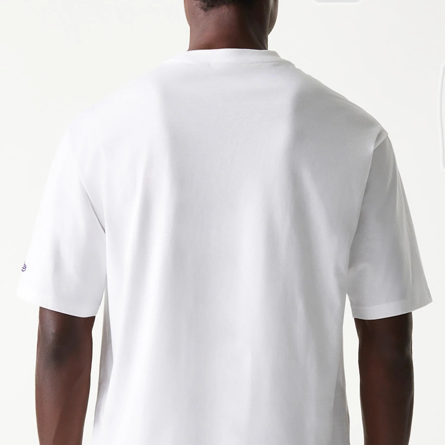 The Male model is wearing LA Lakers NBA Team Graphic White Oversized T-Shirt 7