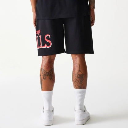 The Male model is wearing Chicago Bulls NBA Team Graphic Black Shorts 2