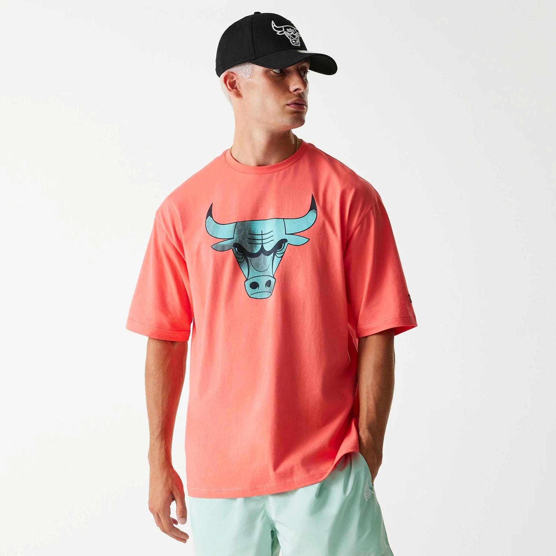 The Male model is wearing Chicago Bulls NBA All Over Print Infill Pink Oversized T-Shirt 1