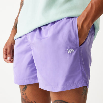 The Male model is wearing New Era Purple Swim Shorts 4