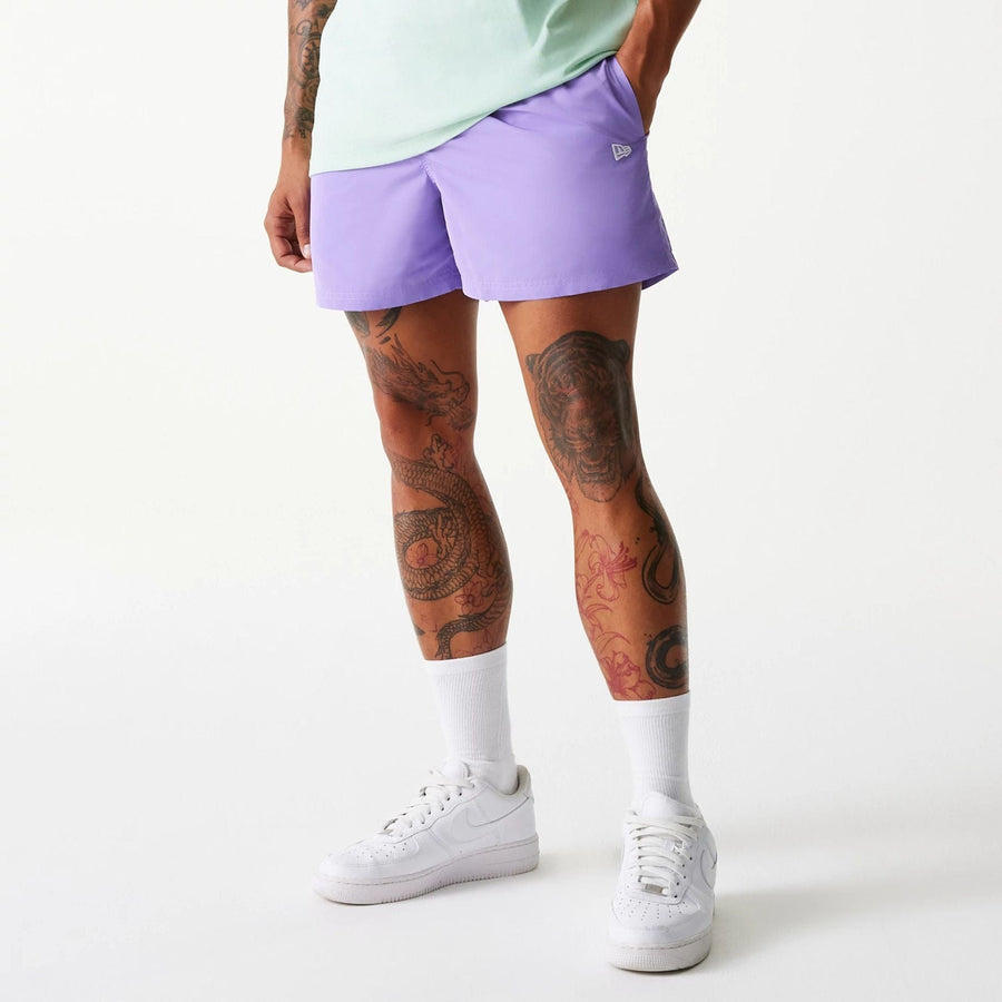The Male model is wearing New Era Purple Swim Shorts 1