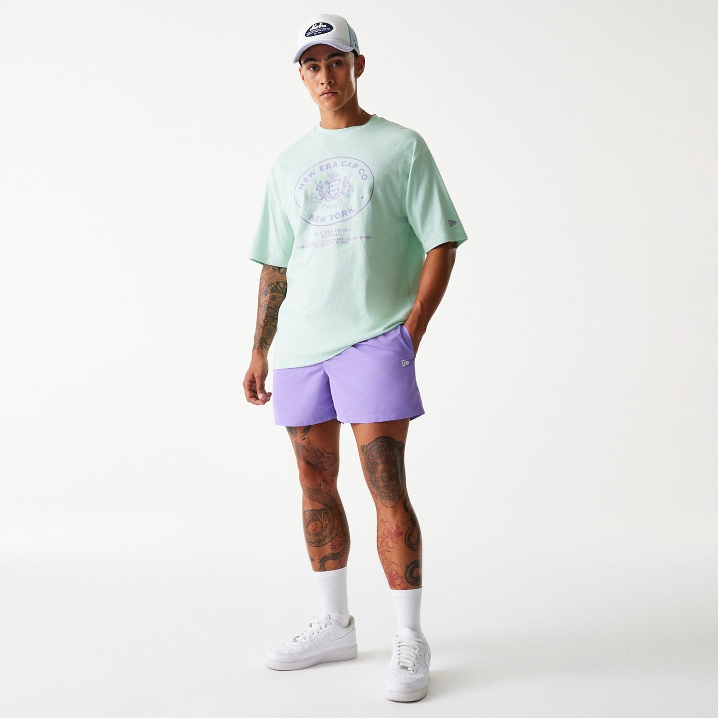 The Male model is wearing New Era Purple Swim Shorts 8
