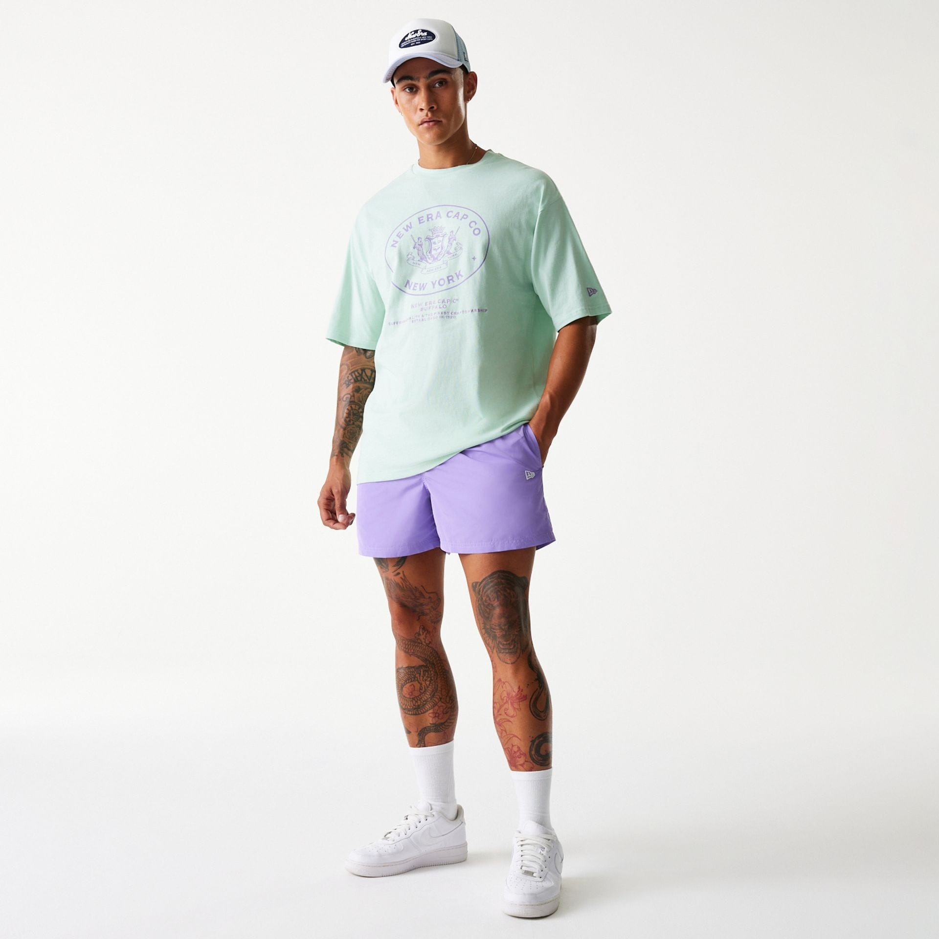 The Male model is wearing New Era Purple Swim Shorts 8