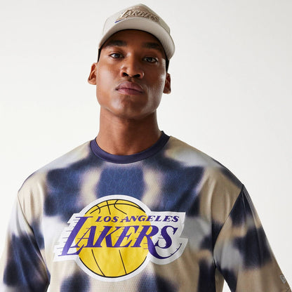The Male model is wearing LA Lakers NBA All Over Print Cream Oversized T-Shirt 4