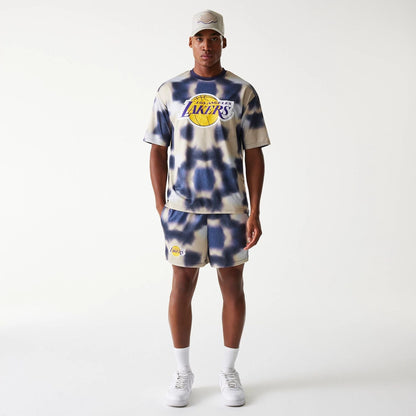 The Male model is wearing LA Lakers NBA All Over Print Cream Oversized T-Shirt 8