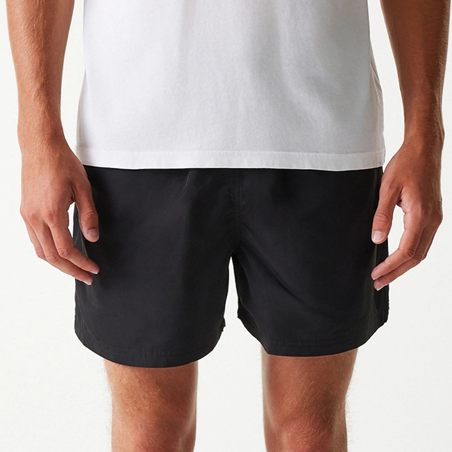 The Male model is wearing New Era Black Swim Shorts 3