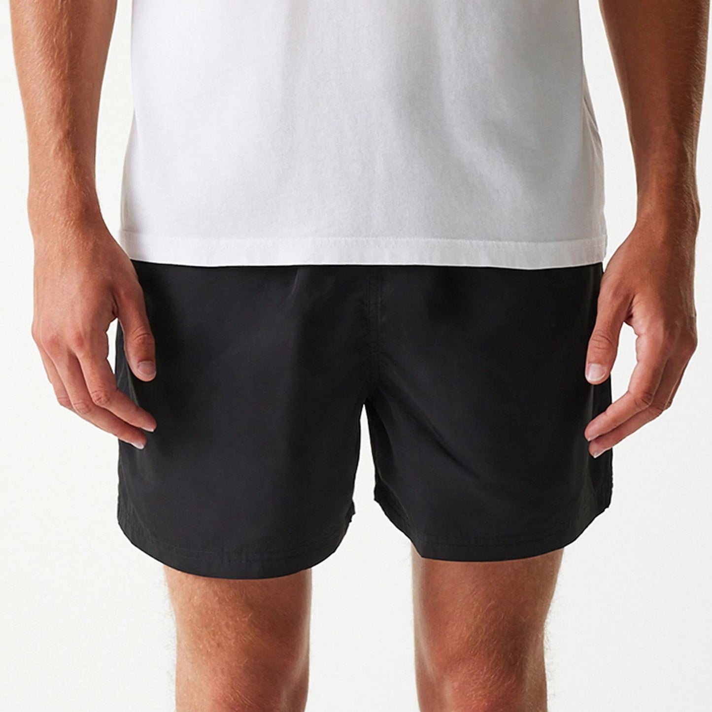 The Male model is wearing New Era Black Swim Shorts 3