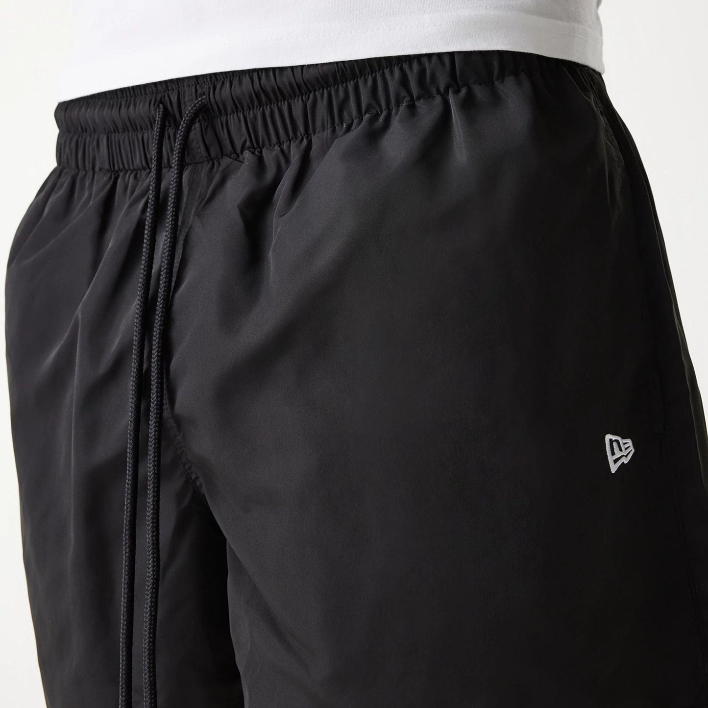 The Male model is wearing New Era Black Swim Shorts 7