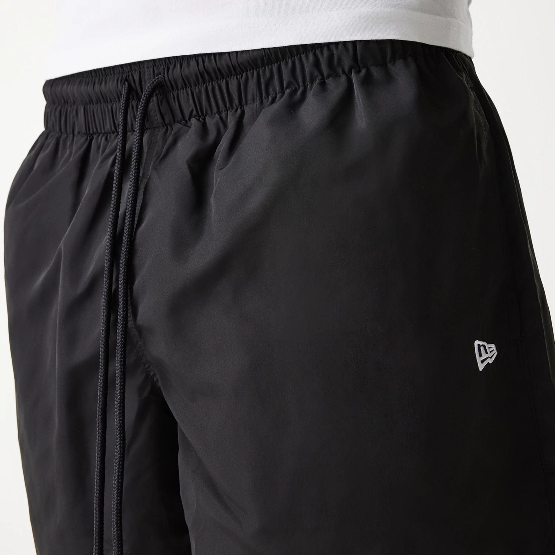The Male model is wearing New Era Black Swim Shorts 7