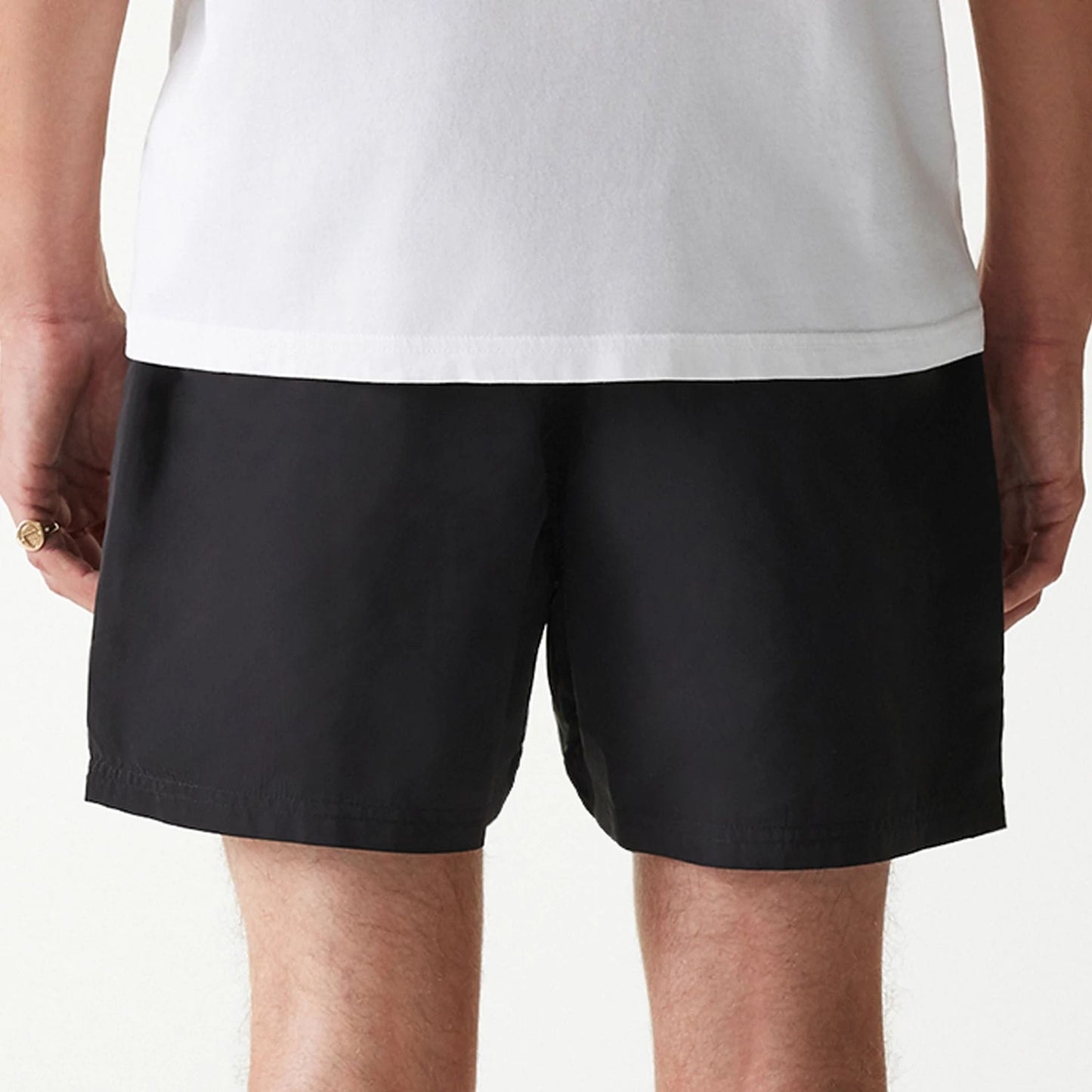 The Male model is wearing New Era Black Swim Shorts 6