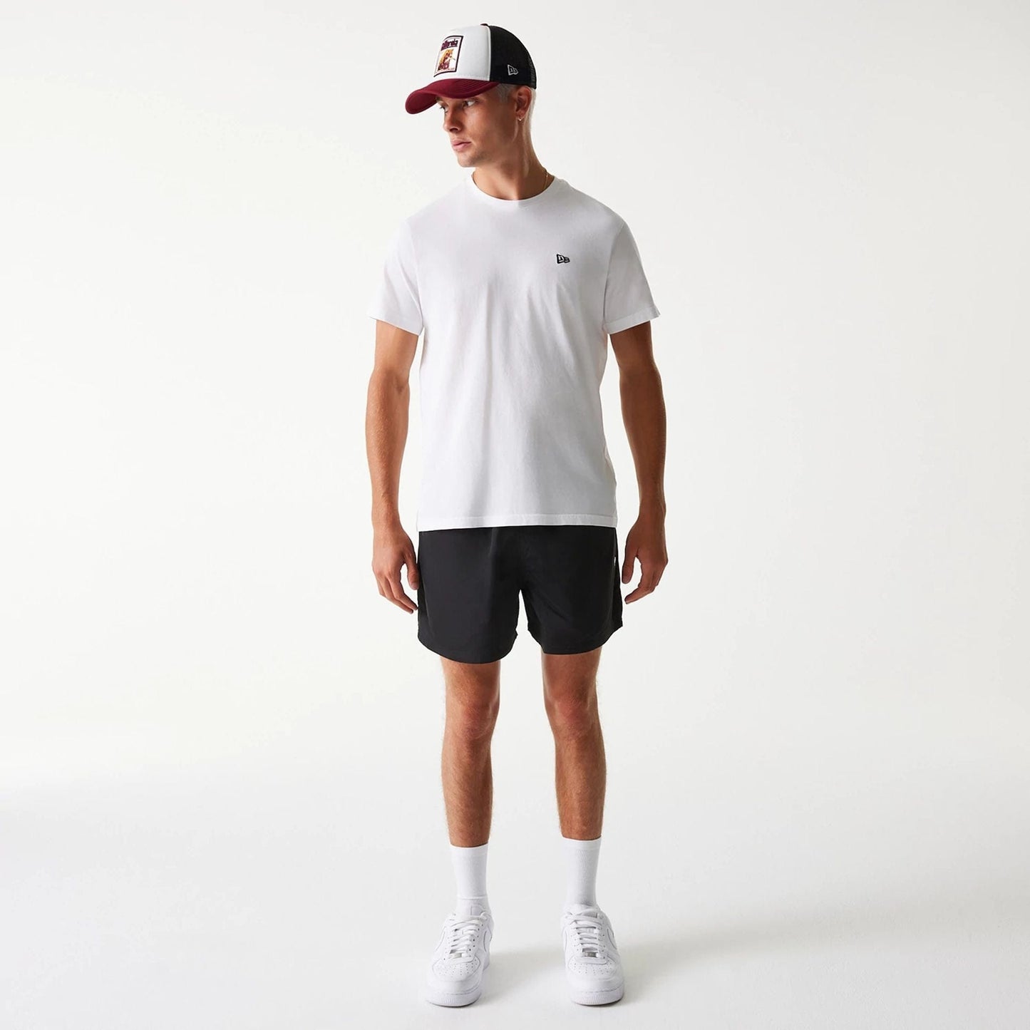 The Male model is wearing New Era Black Swim Shorts 8