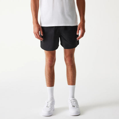 The Male model is wearing New Era Black Swim Shorts 1