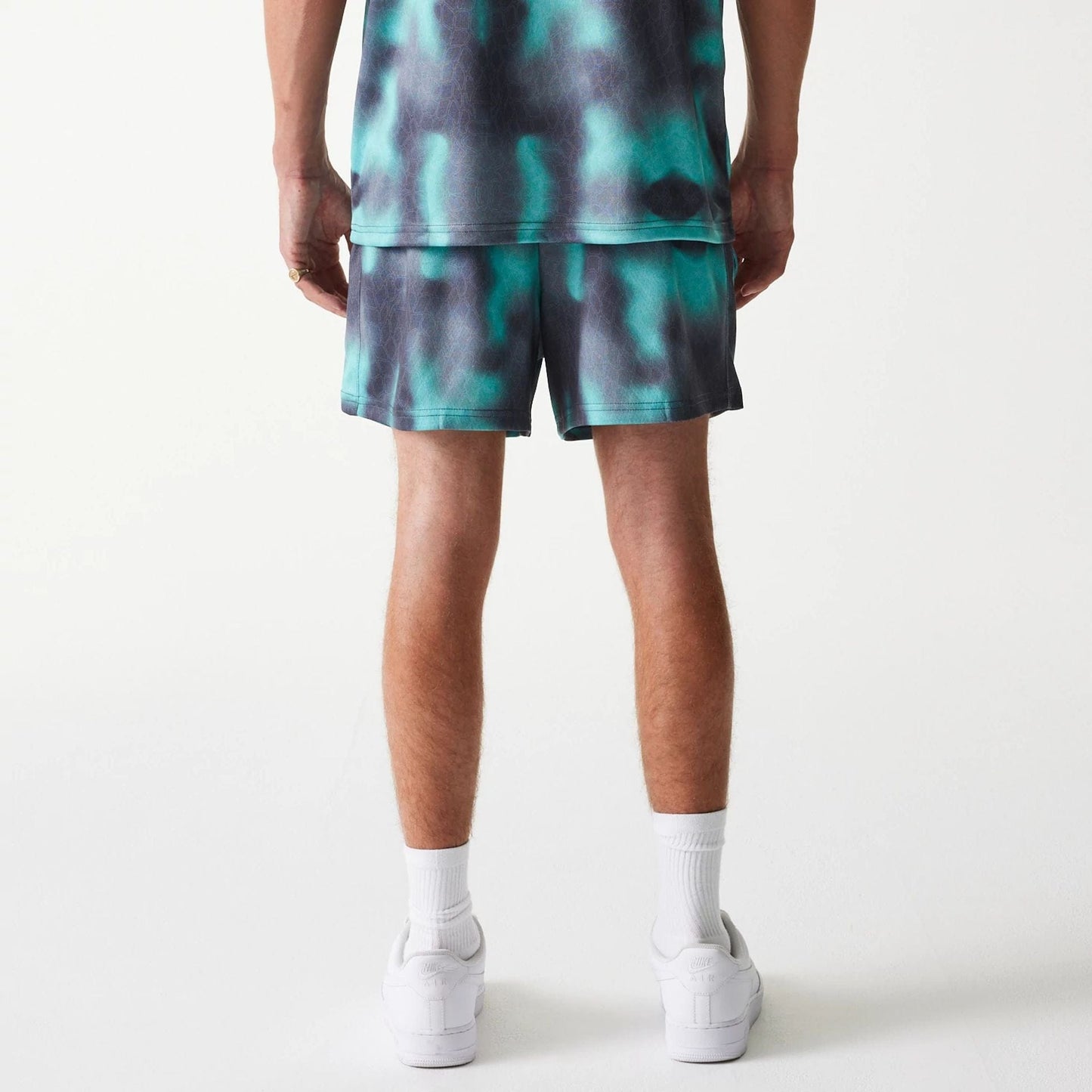 The Male model is wearing Chicago Bulls NBA All Over Print Green Shorts 2