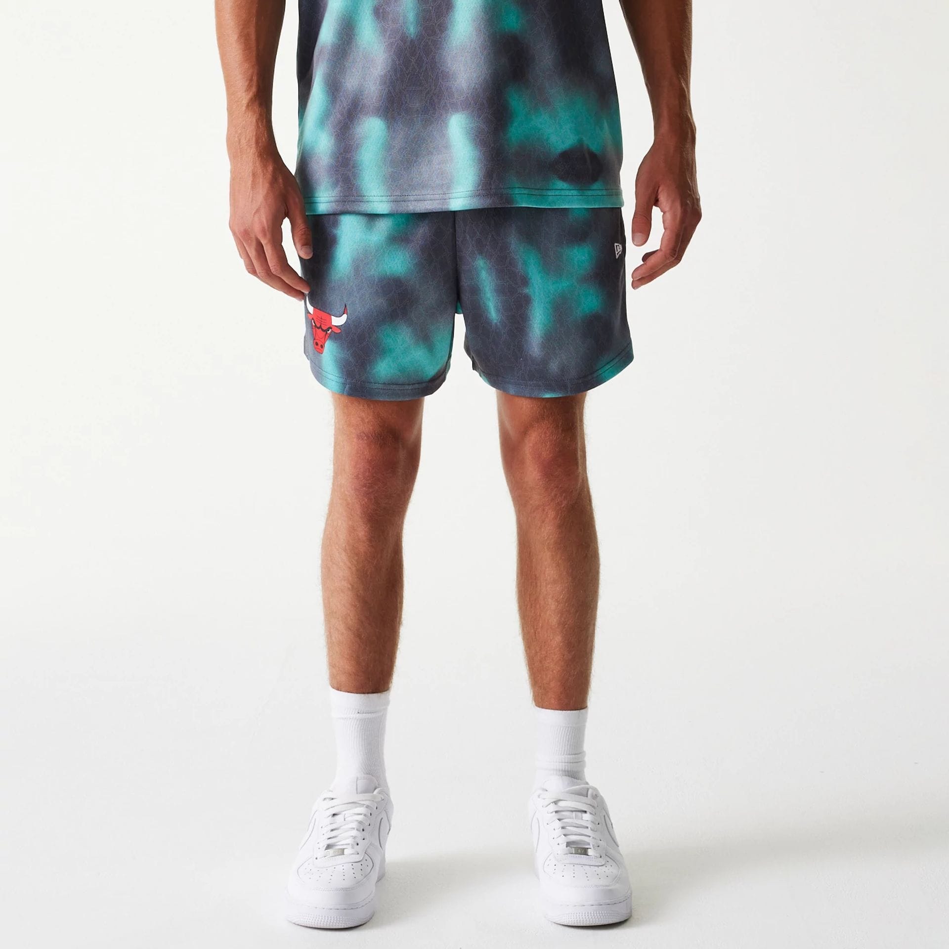 The Male model is wearing Chicago Bulls NBA All Over Print Green Shorts 1