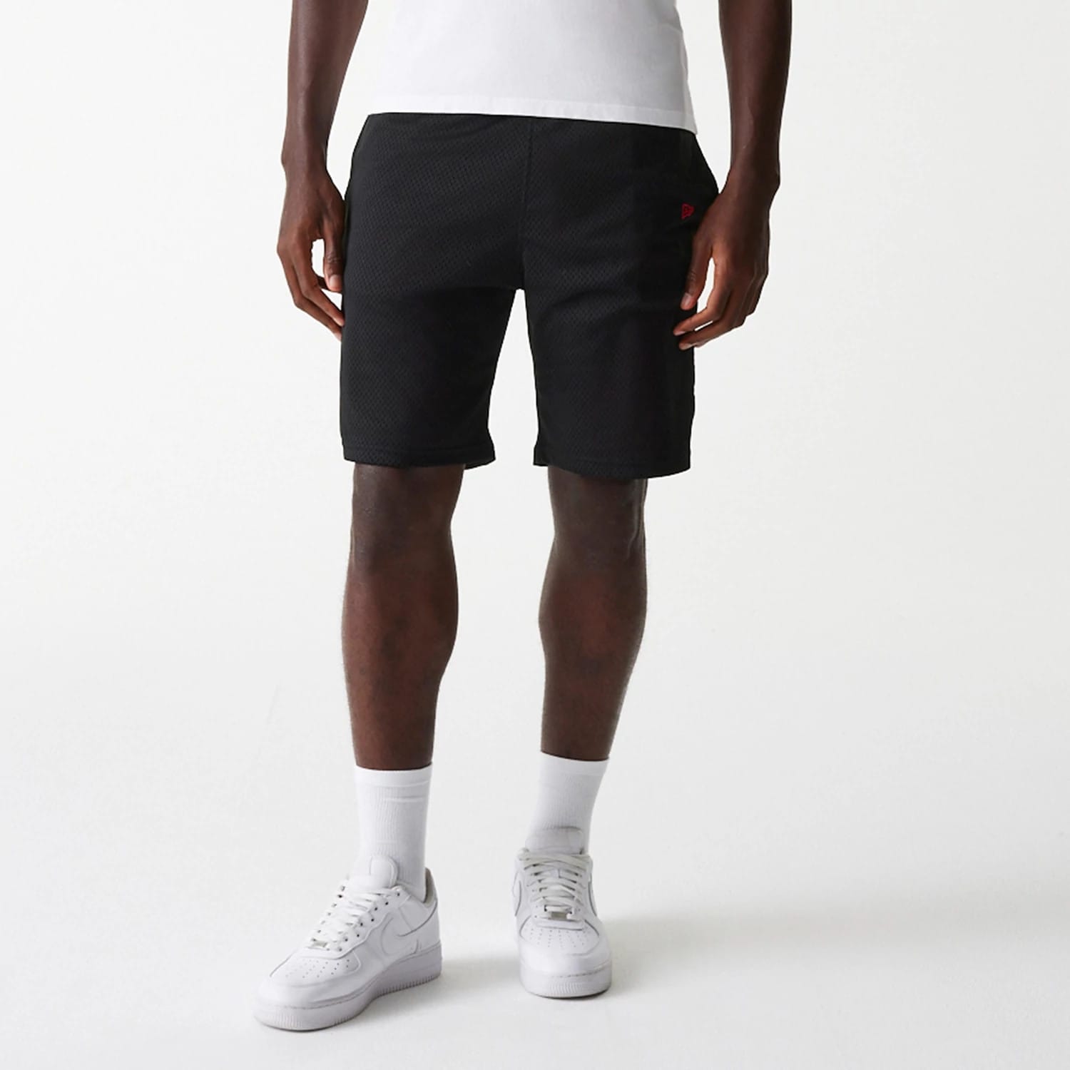 The Male model is wearing New Era Black Mesh Shorts 3