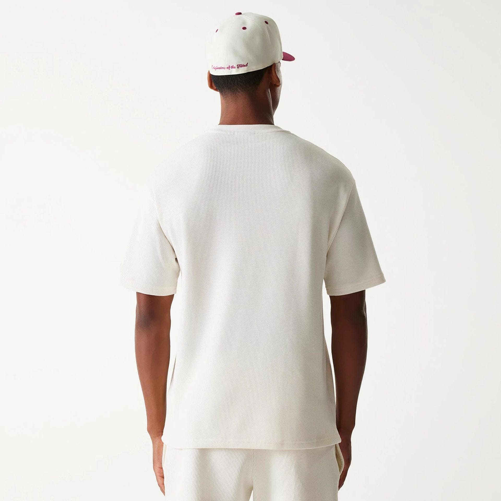 The Male model is wearing New Era Waffle Open White Oversized T-Shirt 2
