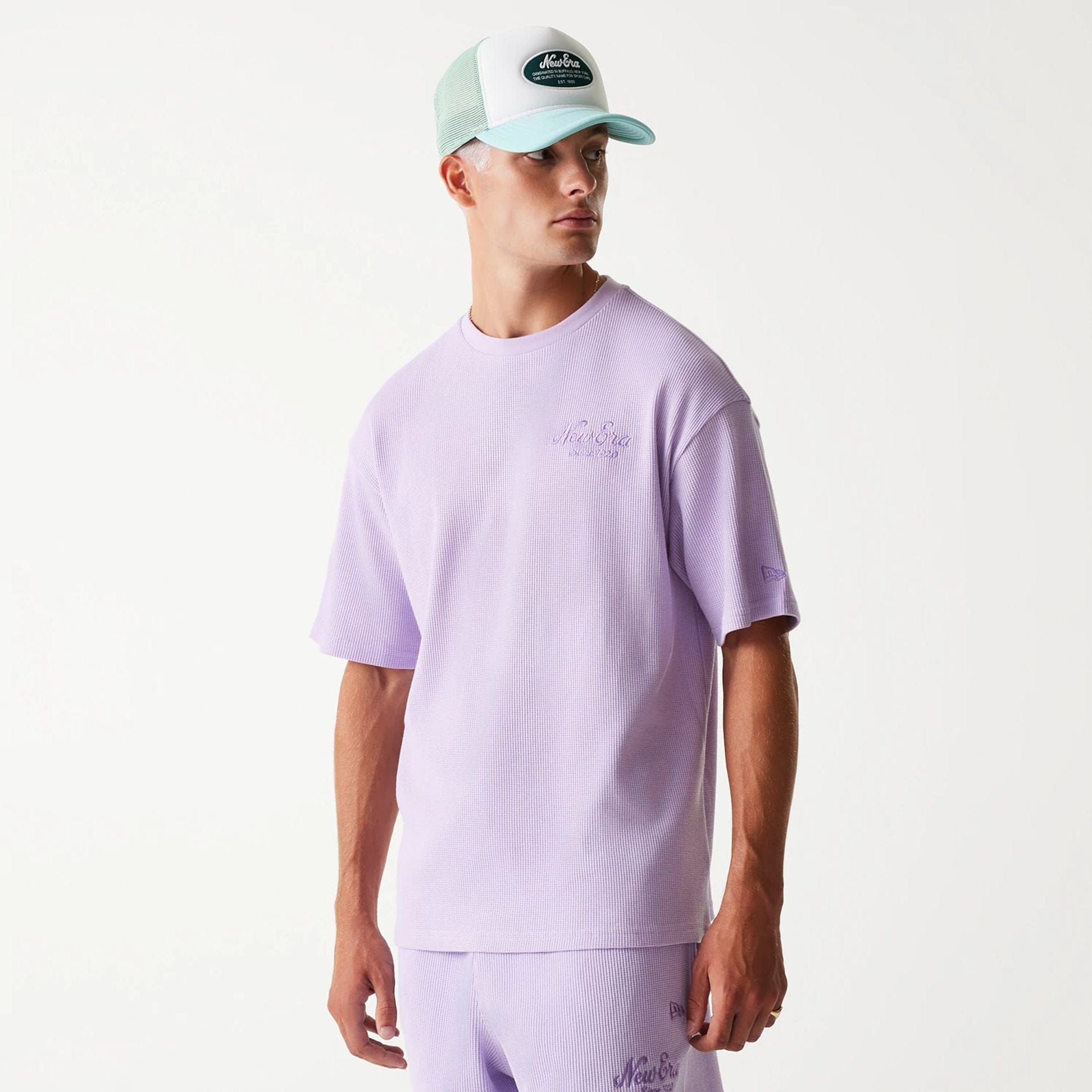 The Male model is wearing New Era Waffle Pastel Purple Oversized T-Shirt 3
