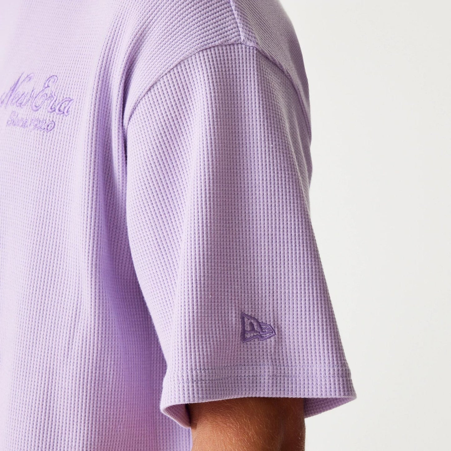The Male model is wearing New Era Waffle Pastel Purple Oversized T-Shirt 7