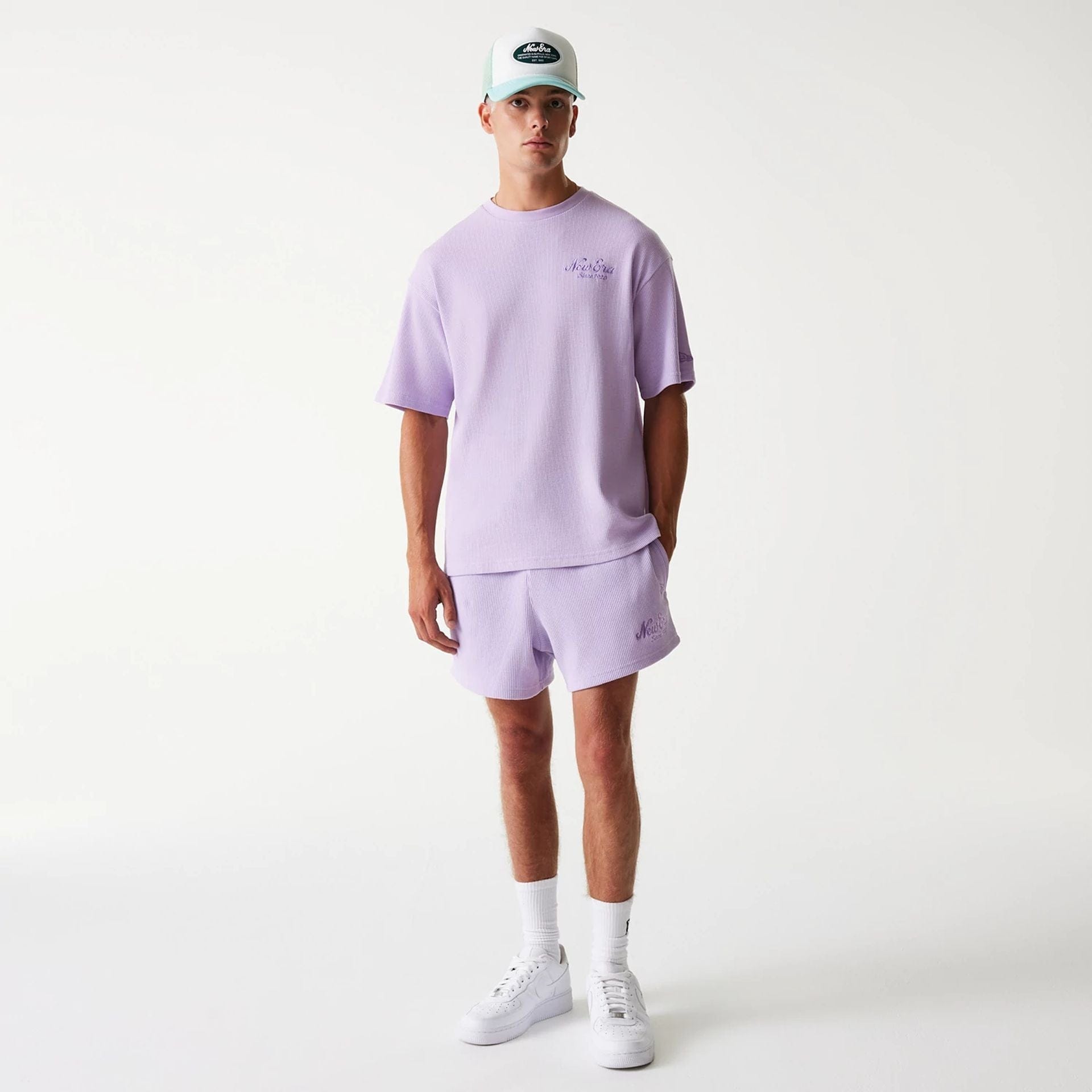 The Male model is wearing New Era Waffle Pastel Purple Oversized T-Shirt 8