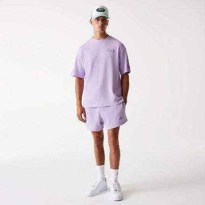 The Male model is wearing New Era Waffle Pastel Purple Oversized T-Shirt 8
