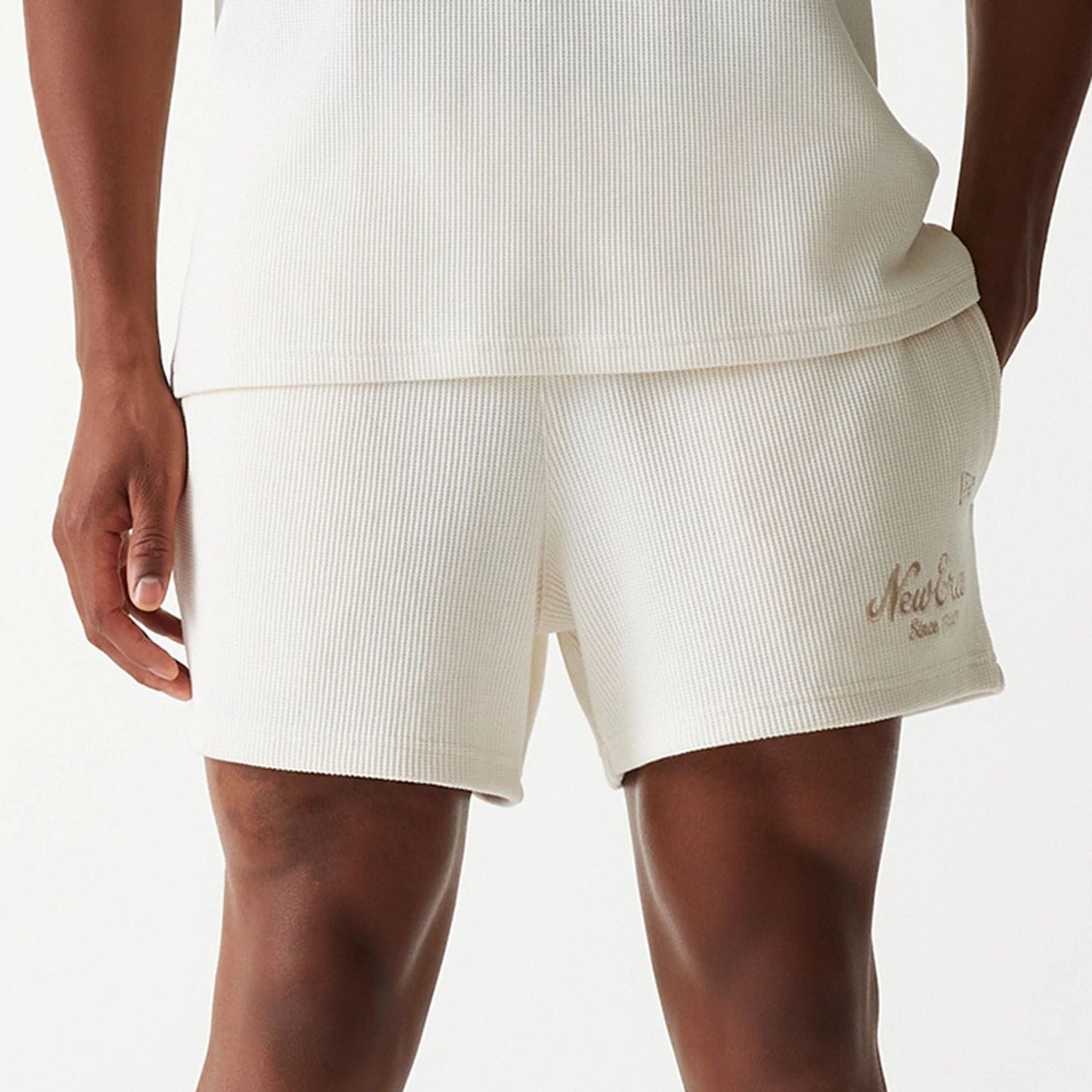 The Male model is wearing New Era Waffle Open White Shorts 3