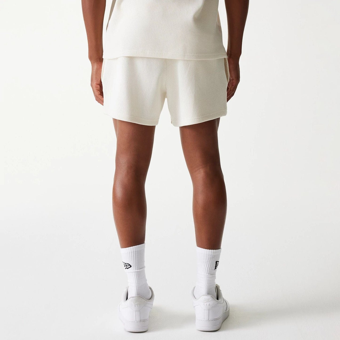 The Male model is wearing New Era Waffle Open White Shorts 2